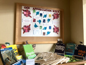 Poster and tabletop display celebrating OER at Oregon Coast Community College